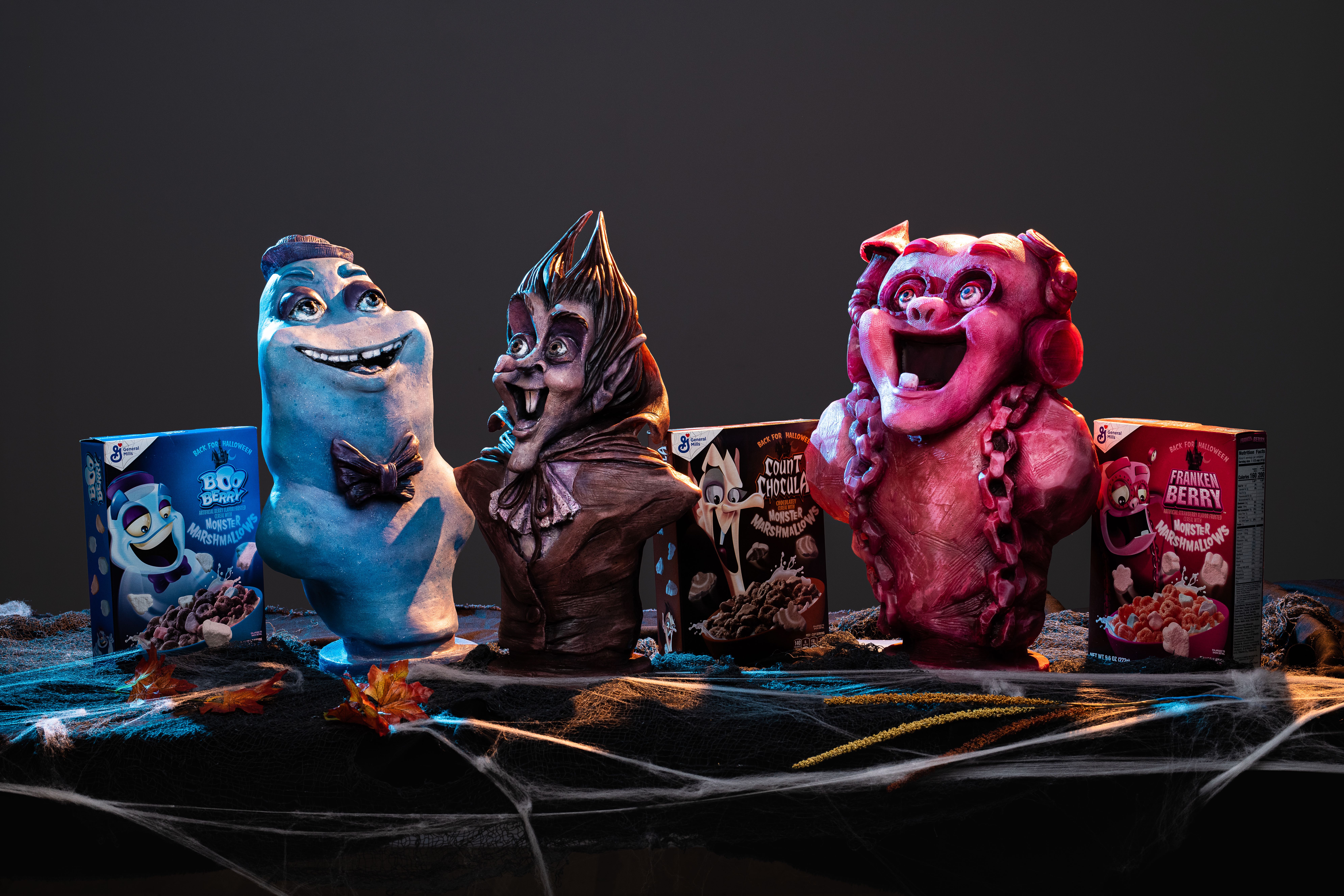 Monster Cereal busts with their cereal boxes